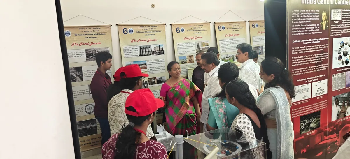 Visitors look at the exhibition panels