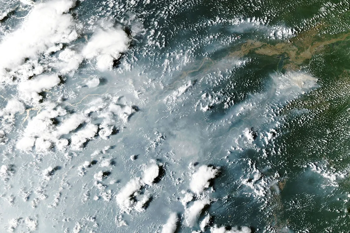Amazon fires: Smoke streams from fires along the Amazon River, seen by NASA's Aqua satellite on 12 October 2026