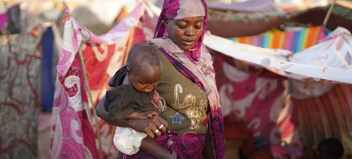 Sudan women: A displaced mother near her shelter in a camp in Tawila, North Darfur