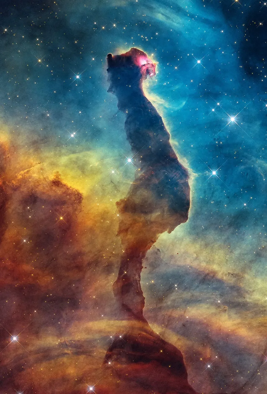 Cat's Head Nebula: Hubble image of the Cat's Head Nebula, an opaque dust pillar edged by a luminous rim of gas